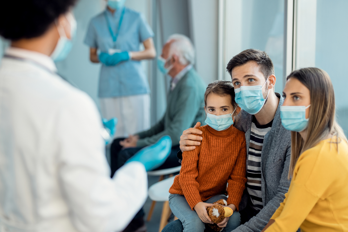 Family consulting a pediatric cancer specialist about treatment options