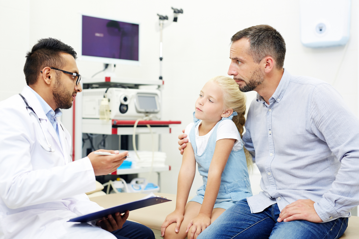 Parents consulting a pediatric oncology specialist about lung cancer diagnosis