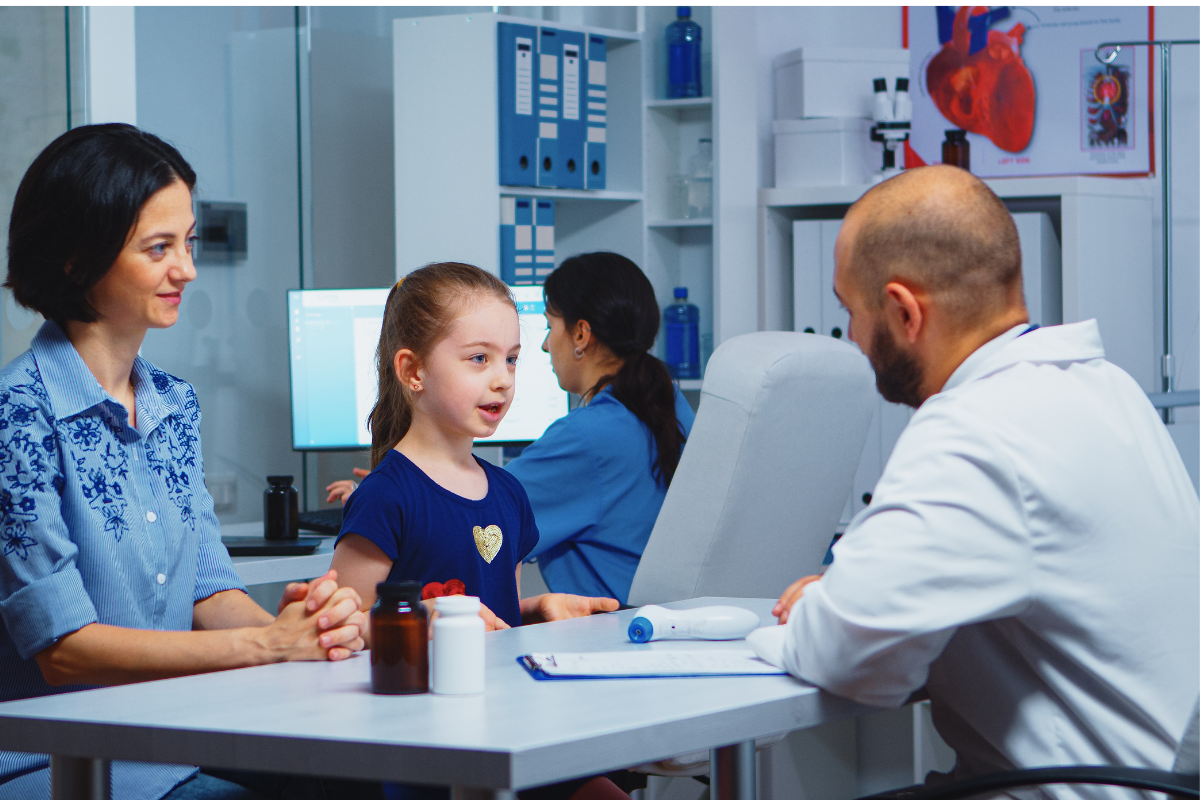 Pediatric specialist discussing lung health concerns with parents
