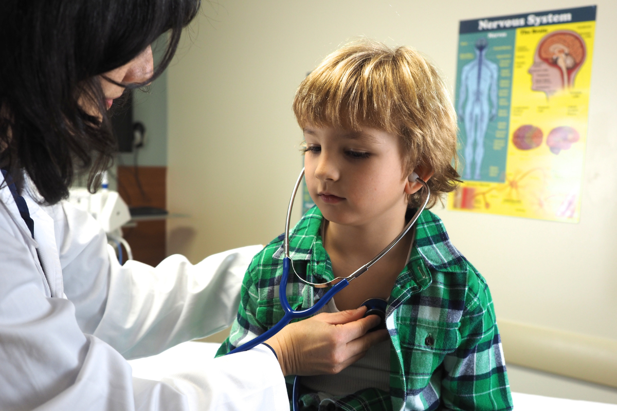 Pediatric specialist evaluating a child with chest pain symptoms